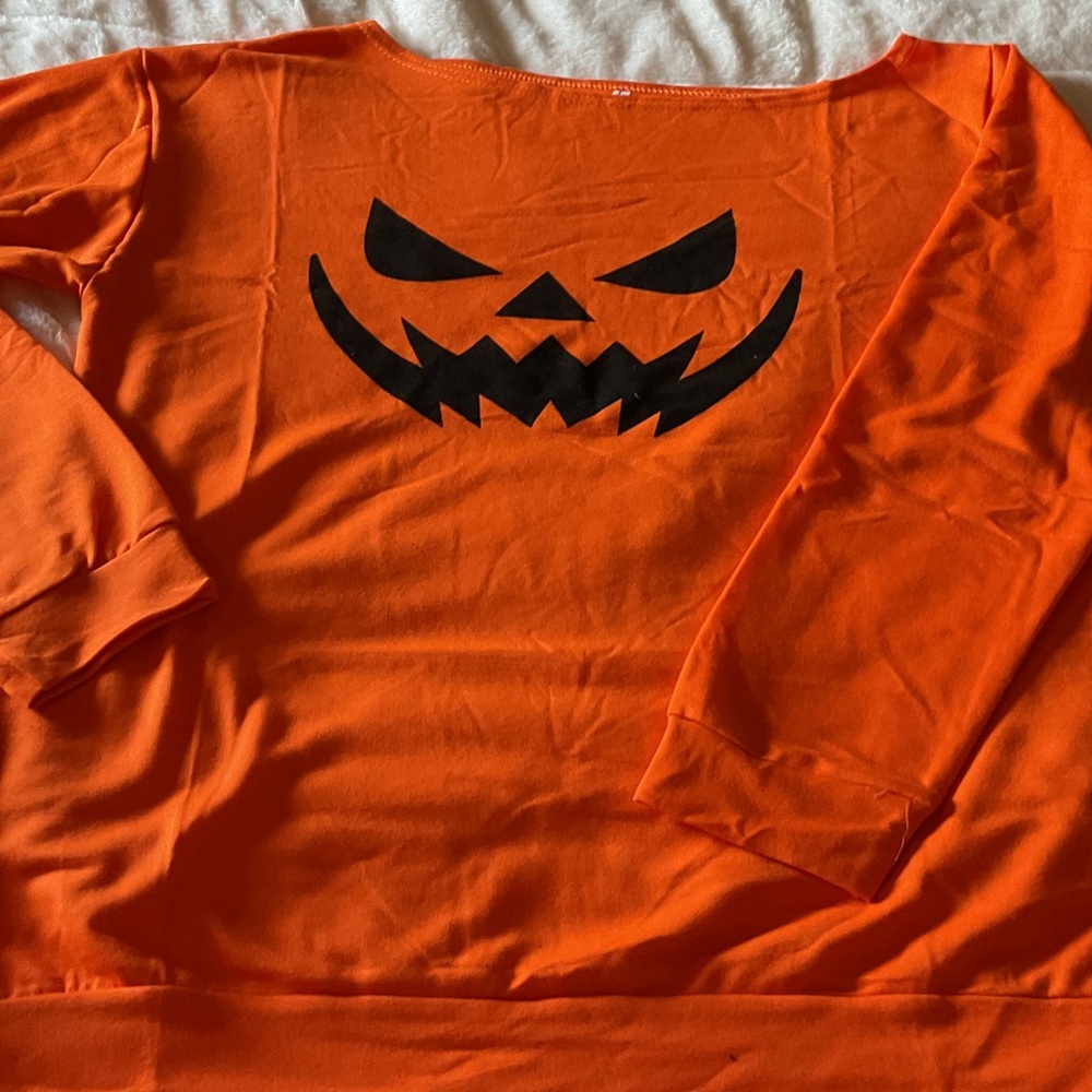 Orange Off-the-Shoulder Sweater with Black Pumpkin Design